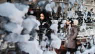 People are reflected in a frozen window the morning after a massive winter storm on January 5, 2018 in Boston, United States. Schools and businesses throughout the Boston area get back to work today after the city received over a foot of snow during a fas