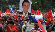 Supporters of presidential candidate for the Opposition Alliance Against the Dictatorship, Salvador Nasralla, take part in a march to claim Nasrallas presidency in San Pedro Sula, 180 km north of Tegucigalpa, on January 6, 2018. AFP.