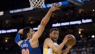 Golden State Warriors guard Stephen Curry (30) shoots the basketball against New York Knicks center Enes Kanter (00) during the third quarter at Oracle Arena. The Warriors defeated the Knicks 123-112. Kyle Terada-USA TODAY Sports