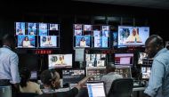 Staff work in a control during a news program at NTV studios in Nairobi on February 6, 2018. AFP / Yasuyoshi Chiba