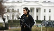 A uniformed US Secret Service officer stands guard after a passenger vehicle struck a security barrier near the White House in Washington, US, February 23, 2018. REUTERS/Jim Bourg