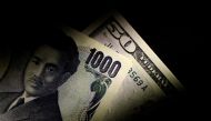 FILE PHOTO: Japan Yen and U.S. Dollar notes are seen in this June 22, 2017 illustration photo. REUTERS/Thomas White/Illustration/File Photo
