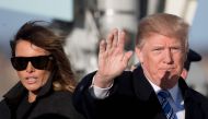 US President Donald Trump and First Lady Melania Trump walk off Air Force One at Andrews Air Force Base, Maryland, on March 3, 2018. / AFP / JIM WATSON
