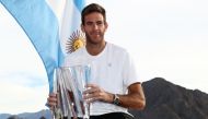 Juan Martin Del Potro of Argentina poses with the winner's trophy after defeating Roger Federer of Switzerland during the men's final on Day 14 of the BNP Paribas Open at the Indian Wells Tennis Garden on March 18, 2018 in Indian Wells, California. Matthe