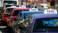 Taxis line up for passengers in Baltimore, MD on March 26, 2018. AFP / David Gannon