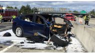 Rescue workers attend the scene where a Tesla electric SUV crashed into a barrier on U.S. Highway 101 in Mountain View, California, March 25, 2018. Picture taken March 25, 2018. KTVU Fox 2/via Reuters