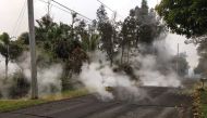 Steam rises from fissure 9 on Moku Street in the Leilani Estates subdivision, in Hawaii, U.S. May 7, 2018. Picture taken on May 7, 2018. USGS/Handout via REUTERS