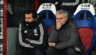 (FIles) In the file picture taken on March 5, 2018, Manchester United's Portuguese manager Jose Mourinho (R) sits beside his assistant, Rui Faria in the dugout during the English Premier League football match against Crystal Palace at Selhurst Park in sou