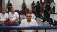 Former Salvadoran President (2004-2009) Elias Antonio Saca, along with six of his collaborators, waits for the judge to arrive in court in San Salvador on May 16, 2018, to face charges of embezzlement and laundering for allegedly diverting 298 million dol