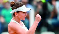 Romania's Simona Halep celebrates after winning her match against Japan's Naomi Osaka at Rome's WTA Tennis Open tournament at the Foro Italico, on May 16, 2018 in Rome.  AFP / Filippo Monteforte
