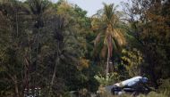 Firefighters work at the wreckage site of a Boeing 737 plane that crashed in the agricultural area of Boyeros, around 20 km (12 miles) south of Havana, shortly after taking off from Havana's main airport in Cuba, May 18, 2018. REUTERS/Alexandre Meneghini 