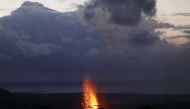 Lava erupts from a Kilauea volcano fissure on Hawaii's Big Island on May 18, 2018 in Kapoho, Hawaii. Mario Tama/Getty Images/AFP 