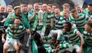 Celtic players celebrate with the trophy after winning the Scottish Cup REUTERS/Russell Cheyne
