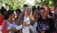 Relatives of victims of the Boeing 737 plane that crashed after taking off from Havana's main airport yesterday, react as they leave the Legal Medical Institute in Havana, Cuba, May 19, 2018. REUTERS/Alexandre Meneghini