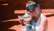 Ukraine's Elina Svitolina poses with the trophy after winning the women's final against Romania's Simona Halep at Rome's WTA Tennis Open tournament at the Foro Italico, on May 20, 2018 in Rome. AFP / Filippo Monteforte