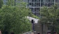 Police officer is seen among pedestrians after a hit-and-run incident at Portland State University, in Portland, Oregon, U.S., May 25, 2018 in this still image obtained from social media video. MATTHEW RITZI/via REUTERS 
