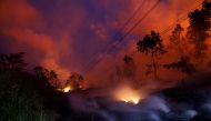 Volcanic gases rise from the Kilauea lava flow that crossed Pohoiki Road near Highway 132, near Pahoa, Hawaii, US, May 28, 2018. REUTERS/Marco Garcia