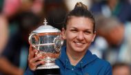 Romania’s Simona Halep celebrates with the trophy after winning the final against Sloane Stephens of the U.S. (REUTERS/Charles Platiau)