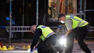 Policemen search the scene after five people were hurt in a shooting in the centre of the southern Swedish city of Malmo on June 18, 2018.  AFP / Johan NILSSON