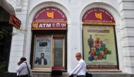 People walk past Punjab National Bank's Brady House branch in Mumbai, India June 14, 2018. REUTERS/Francis Mascarenhas