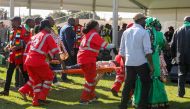 Medics attend to people injured in an explosion during a rally by Zimbabwean President Emmerson Mnangagwa in Bulawayo, Zimbabwe June 23, 2018. Tafadzwa Ufumeli/REUTERS 

