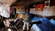 A child walks in his house, which was partly destroyed by flooding water after a dam burst, in Solio town near Nakuru, Kenya May 10, 2018. Reuters/Thomas Mukoya