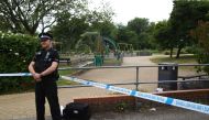 A police officer stands at a cordon at Queen Elizabeth Gardens in Salisbury, southern England, on July 4, 2018 believed to be cordoned off in relation to a major incident declared after two people were found unconcious at a residence in nearby Amesbury. A