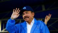 Nicaragua's President Daniel Ortega waves to supporters during celebrations to mark the 39th anniversary of the 