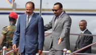 Eritrea president Issaias Afeworki (L) is welcomed upon arrival by Prime minister of Ethiopia Abiy Ahmed on July 14, 2018 at Addis Ababa Bole International Airport for his official visit to Ethiopia after more than twenty years in border conflict among th