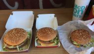 A Grand Big Mac (left) and Mac Jr. (right) alongside a regular Big Mac (center), released for a limited time in the UK as part of the 50th anniversary of the burger. Photo courtesy: Mojo0306 /CC BY-SA 4.0/ Wikimedia Commons