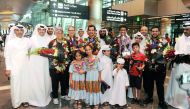 Qatar Bowling Federation officials and fans pose for a photograph with the victorious Qatar bowling team members upon their return from the USA at the Hamad International Airport in Doha yesterday.
Pictures: Abdul Basit / The Peninsula