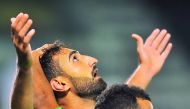 Al Ahli’s Ali Fereydoun (left) celebrates with a team-mate after scoring his second goal during their QNB Stars League match against Qatar SC at the Al Sadd Stadium yesterday. Picture by: Baher Amin / The Peninsula 
