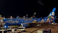 Air Alaska planes sit on the tarmac at the terminal, following an incident where an airline employee took off in an airplane, at Seattle-Tacoma International Airport in Seattle, August 10, 2018. Reuters/Brendan McDermid 
 
 