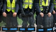 Virginia State Troopers stand down during a rally on the campus of The University of Virginia one-year after the violent white nationalist rally that left one person dead and dozens injured, in Charlottesville, Virginia on August 11, 2018./ AFP / Logan Cy