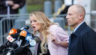 Stephanie Clifford also known as Stormy Daniels speaks outside US Federal Court with her lawyer Michael Avenatti in Lower Manhattan on April 16, 2018. (AFP / Eduardo Munoz Alvarez) 
