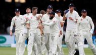 England's Chris Woakes celebrates taking the wicket of India's Hardik Pandya with team mates. (Reuters/Paul Childs)