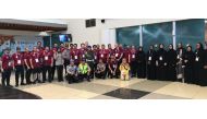 Qatari shooters and archers pose for a photograph with officials upon their arrival in Jakarta, Indonesia yesterday.