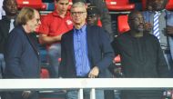 Former French football players and coaches Claude LeRoy and Arsene Wenger arrive with Liberian President George Weah at the stadium to attend a football match in Monrovia on August 23, 2018. AFP / Zoom Dosso 