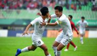 South Korea's Lee Seung-woo (L) celebrates with teammate Son Heung-min (R) after scoring during the men's football semi-final match between Vietnam and South Korea at the 2018 Asian Games in Bogor on August 29, 2018. AFP / Arief Bagus 