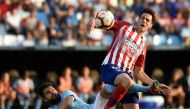 Celta Vigo's Mexican defender Nestor Araujo (L) vies with Atletico Madrid's Croatian forward Nikola Kalinic during the Spanish league football match between RC Celta de Vigo and Club Atletico de Madrid at the Balaidos stadium in Vigo on September 1, 2018.