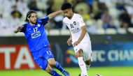 Al Sadd’s Akram Hassan (left) vies for the ball with Esteghlal’s Humam Tarek during their match  at the Jassim Bin Hamad Stadium in Doha yesterday. 