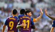 Barcelona's French forward Ousmane Dembele (C) celebrates with Barcelona's Argentinian forward Lionel Messi. AFP / GABRIEL BOUYS

