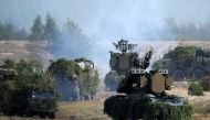 (FILES) In this file photo taken on September 19, 2017 Belarus' OSA-AKM surface-to-air missile launchers and S-300 antiaircraft systems move to firing positions during the joint Russian-Belarusian military exercises Zapad-2017 (West-2017) at a training gr