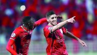 Al Duhail’s Karim Boudiaf (right) celebrates with a team-mate after scoring against Iran's Zob Ahan Esfahan FC in this file photo.