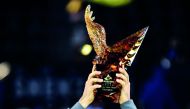Yoshihito Nishioka of Japan celebrates with the trophy after winning the men's singles final against Pierre-Hugues Herbert of France at the ATP Shenzhen Open tennis tournament in Shenzhen, in south China's Guangdong province on September 30, 2018. AFP