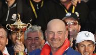 Team Europe players and captain Thomas Bjorn hold the trophy as they celebrate after winning the Ryder Cup. Reuters/Paul Childs

