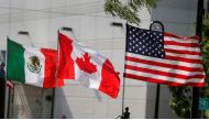 FILE PHOTO: Flags of the U.S., Canada and Mexico fly next to each other in Detroit, Michigan, U.S. August 29, 2018. REUTERS/Rebecca Cook/File Photo