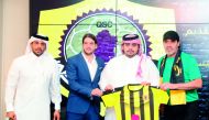 Sergio Batista (right) poses with officials during his unveiling as new Qatar SC coach.