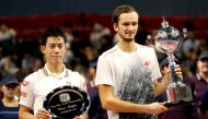 Daniil Medvedev of Russia and Kei Nishikori of Japan pose with their trophies. REUTERS/Kim Kyung-Hoon