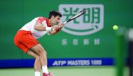 Novak Djokovic of Serbia hits a return against Jeremy Chardy of France during their men's singles first round match at the Shanghai Masters tennis tournament on October 9, 2018. AFP / Johannes Eisele
